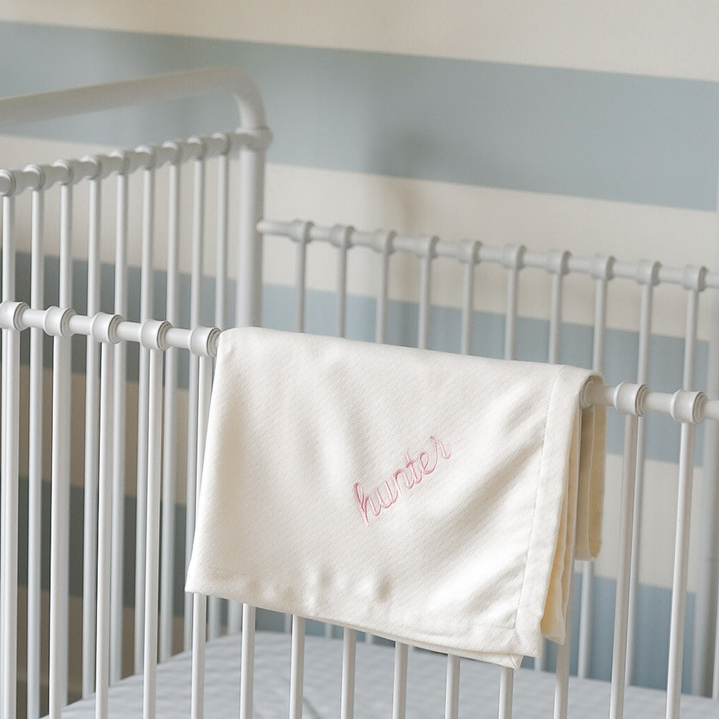 Caption: Monogram style is Script with Light Pink thread.