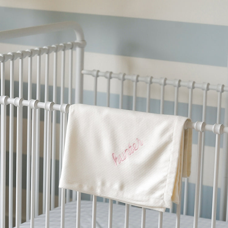 Caption: Monogram style is Script with Light Pink thread.