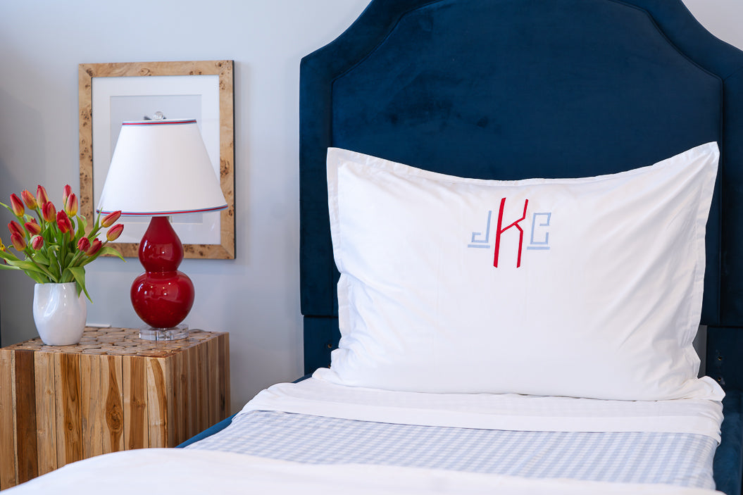 Caption: Royal Euro Sham with Hugo monogram in Light Blue and Red thread.