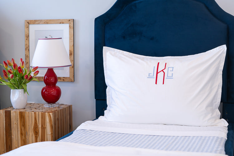 Caption: Royal Euro Sham with Hugo monogram in Light Blue and Red thread.