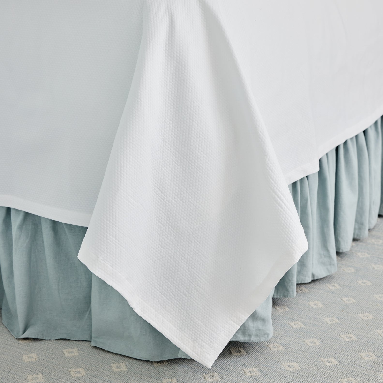 Caption: Diamond Pique Coverlet with Straight Edge finish.