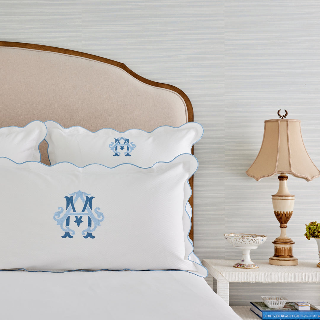 Caption: Euro and King Shams with Light Blue Trim and Royal Double Monogram in Light Blue and Slate thread.