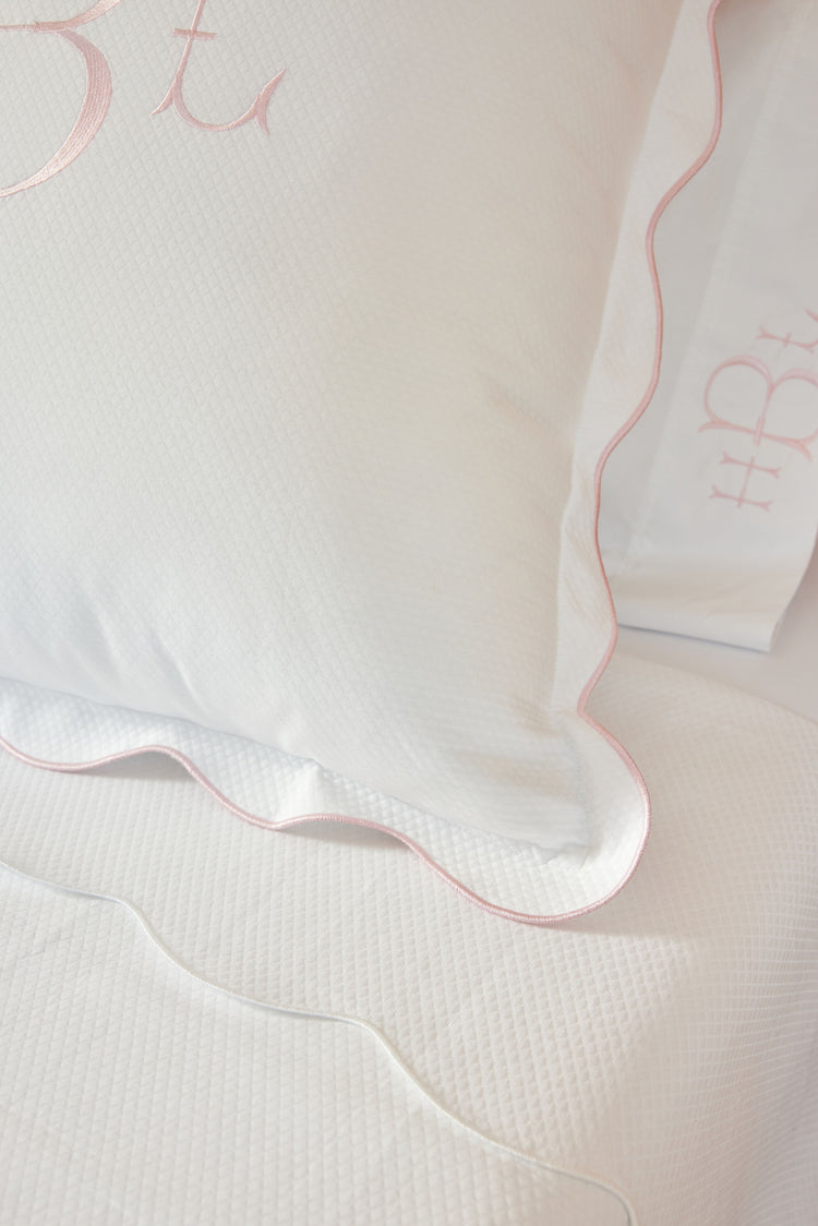 Caption: Diamond Pique pattern with scalloped edge finish.