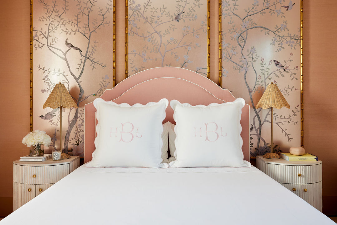 Caption: Euro Shams with Light Pink Trim and Lotus Monogram in Light Pink thread.