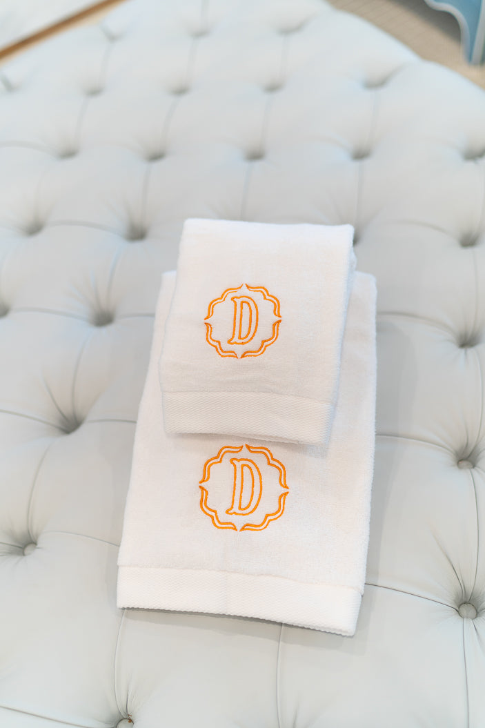 Caption: Monogram style is Poppy with Clementine thread.
